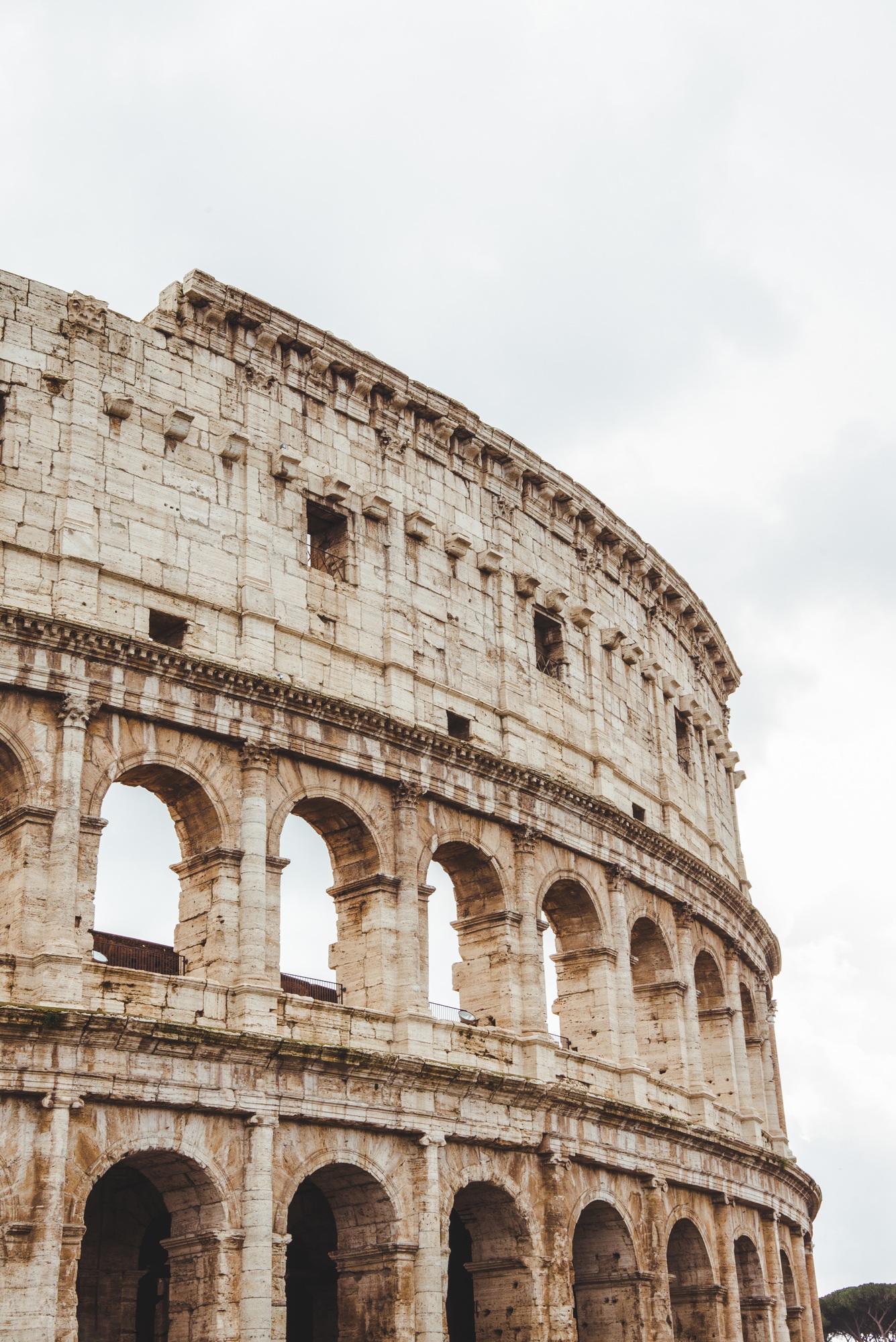 famous Colosseum ruins on cloudy day, Rome, Italy