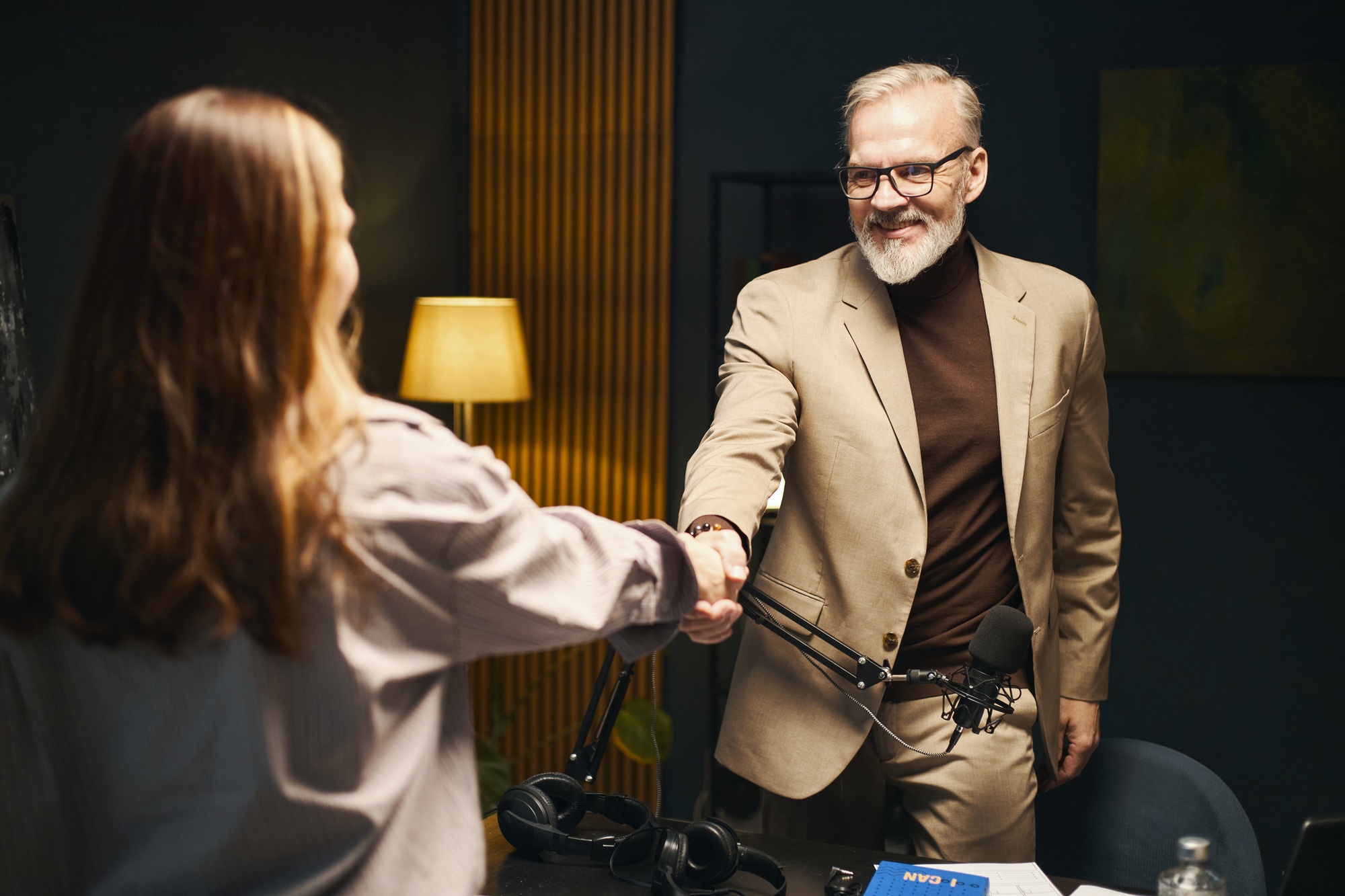 Man Shaking Hand With Journalist