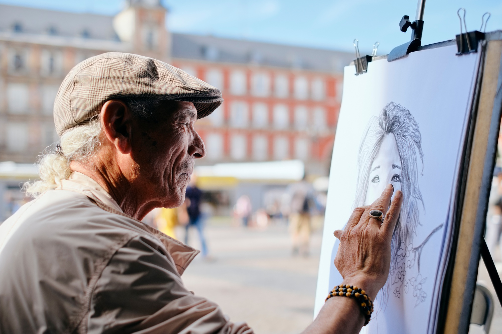 Senior Adult Working As Street Painter In Madrid