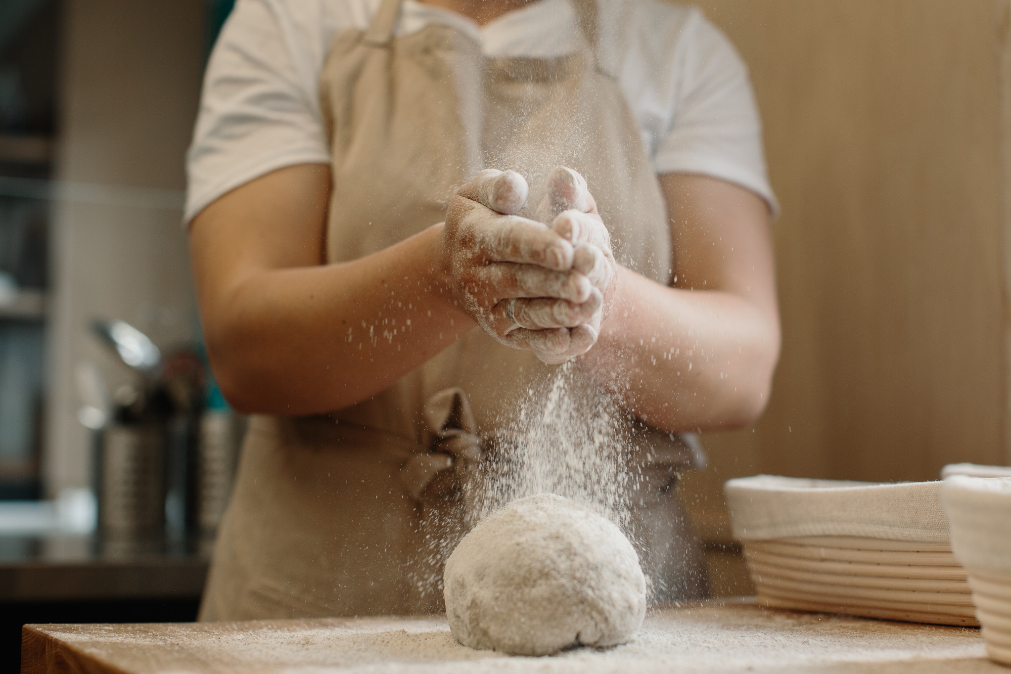 Woman making home made french bread dough.